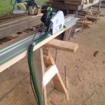 Tracksaw works off sawhorses to cut even edges on bowed boards